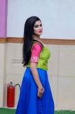 Swasika in green blouse n blue skirt stills (5)